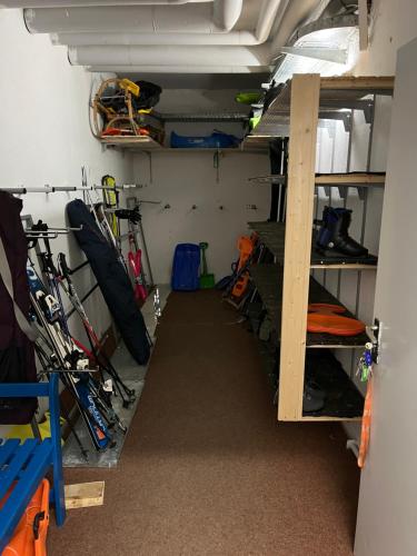 a room with a bunch of ski equipment in it at FitApartman in Mitterfirmiansreut
