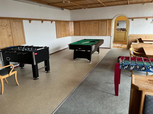 a room with two ping pong tables in it at FitApartman in Mitterfirmiansreut