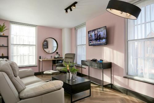a living room with a couch and a table at Dublin One in Dublin