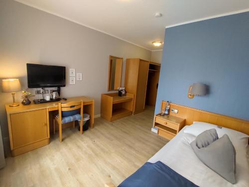 Postel nebo postele na pokoji v ubytování Hotel Zum Märchenwald