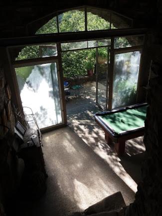 a view of a room with a window and a bench at Le mas des sources cevenol Le chambon in Le Chambon