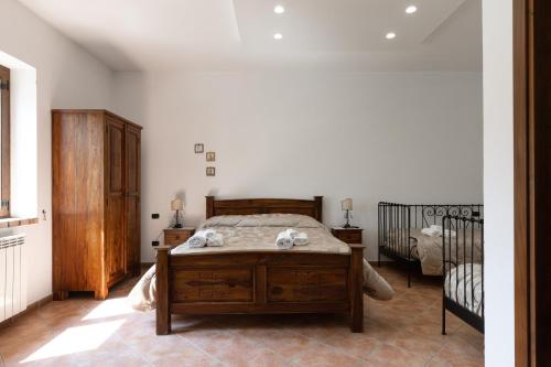 Ένα ή περισσότερα κρεβάτια σε δωμάτιο στο Agriturismo Le Ghiandaie