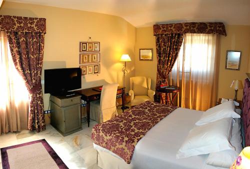 Katil atau katil-katil dalam bilik di Hotel Alcázar de la Reina