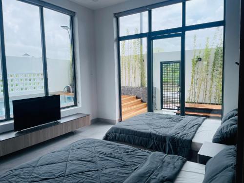 Llit o llits en una habitació de Ri Rot villa - Venuestay