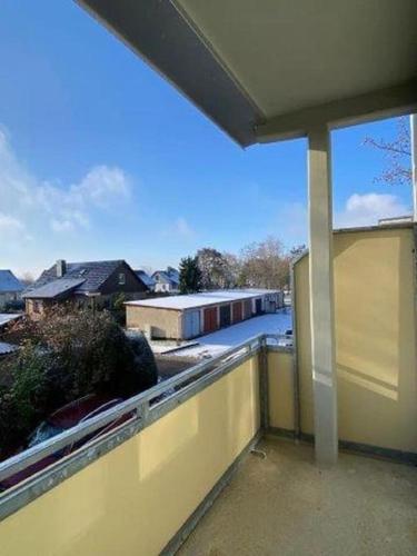 a balcony with a view of a building with a window at Gästewohnung KL. WZL 40_4 