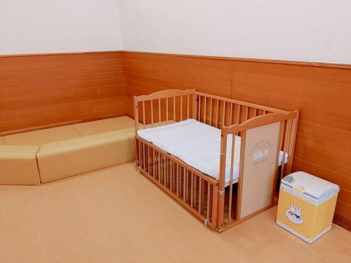 a small room with a bunk bed and a box at Wellness Forest Ito - Kyoritsu Resort in Ito