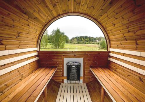 an inside view of a wooden sauna with a window at Premium Ferienhaus Söss Diek in Groß Schwansee in Kalkhorst