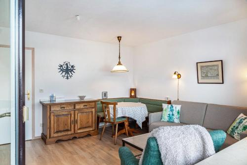a living room with a couch and a table at Haus Excelsior Top 22 in Seefeld in Tirol