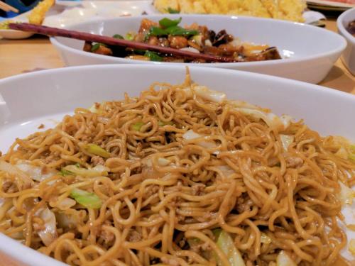 a plate of noodles in a bowl on a table at Wellness Forest Ito - Kyoritsu Resort in Ito