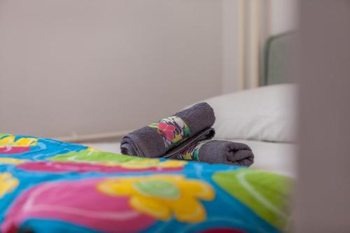 a stuffed teddy bear laying on a bed at Apartment Fabris in Split