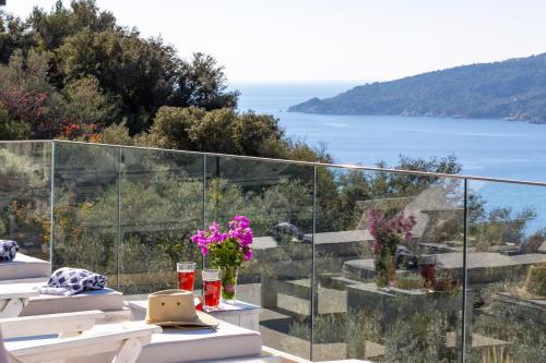 a balcony with a view of the ocean at Villa Moonshine Fantastic View Large Privat Pool in Kalkan