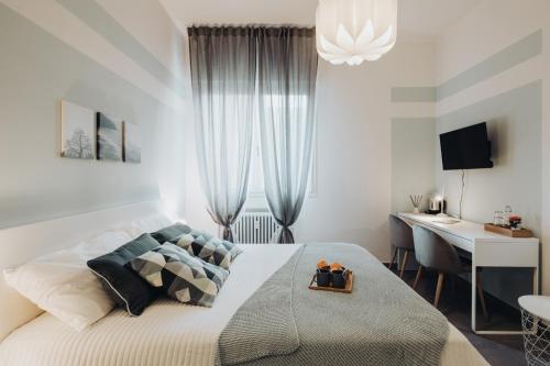 Кровать или кровати в номере Realkasa Graziella