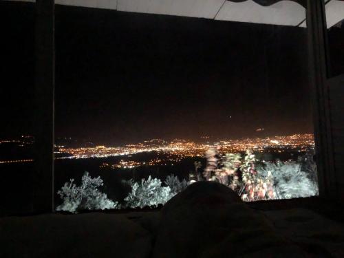 a person sitting in front of a tv with a view at Bursa dağevi in Gürsu