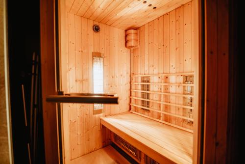 a room with a sauna with a window at Cottage Planska koča in Vitanje