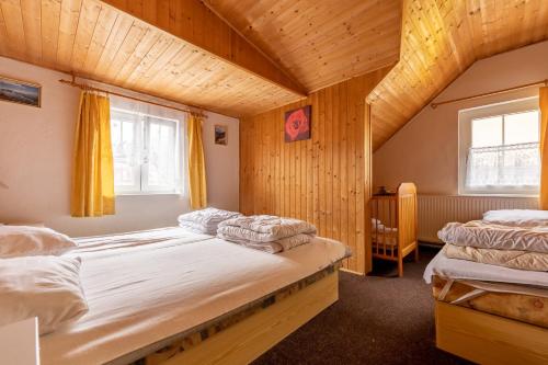 Postel nebo postele na pokoji v ubytování Vakantiehuis Cerny Dul 38