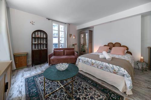 Un ou plusieurs lits dans un hébergement de l'établissement Résidence Aristide Briand - Appartements en Centre Ville