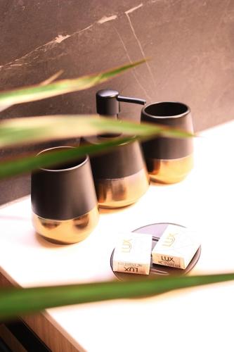 a group of three pots sitting on a counter at Boutique-Pension Jägerwirt in Scheffau am Wilden Kaiser
