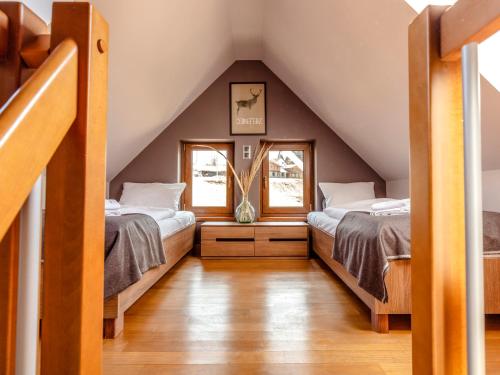 Postel nebo postele na pokoji v ubytování Villa Cam In Ski