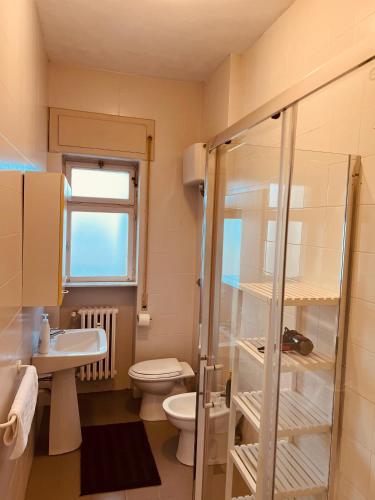 a bathroom with a toilet and a sink and a shower at Sparano Top Class 7 in Bari