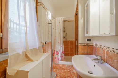 a bathroom with a sink and a shower at La Paolina Vista Mare e Natura in Marciana Marina