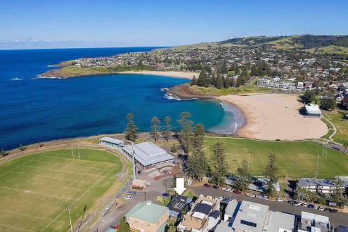 an aerial view of a beach next to the ocean at Driftwood Beach House in Kiama