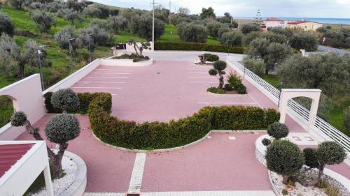 a view of a park with trees and a staircase at Hotel Al Rustico in Crosia