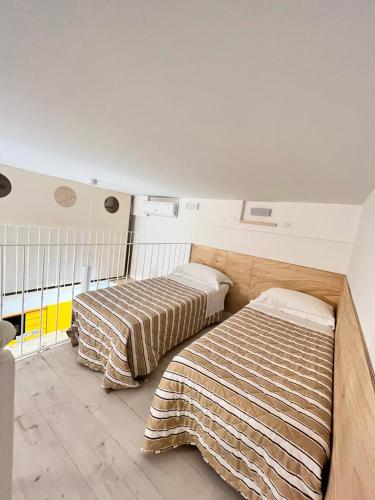Ένα ή περισσότερα κρεβάτια σε δωμάτιο στο La dimora sul porto