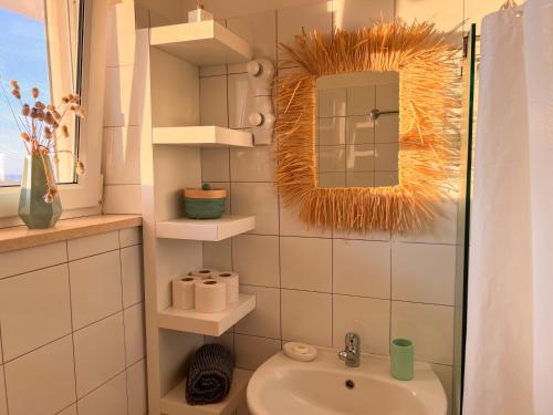 a bathroom with a sink and a mirror at Herdade da Vagem in Rogil