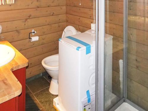 a bathroom with a toilet and a shower stall at Holiday home Svingvoll III in Svingvoll