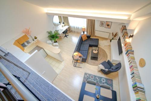 an overhead view of a living room with a couch and a living room at Residence Caesar by Homester in Brno