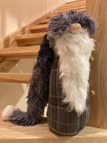 a stuffed animal is sitting on the stairs at Horské apartmány Rejvíz - Borůvka a Brusinka in Rejvíz