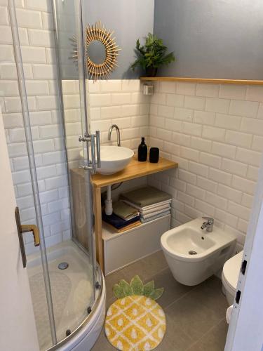 a bathroom with a shower and a sink and a toilet at Mrežnica - Zelena oaza in Generalski Stol
