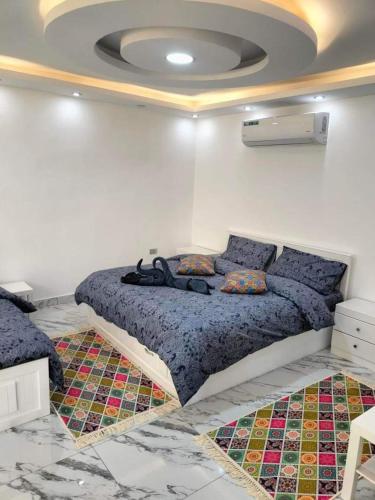 a bedroom with a large bed in a room at Petra Desert Dream Hotel in Wadi Musa