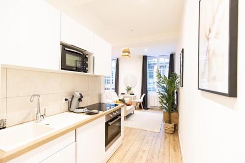 Kuchyňa alebo kuchynka v ubytovaní Luz - Appartement hyper centre Saint-Etienne