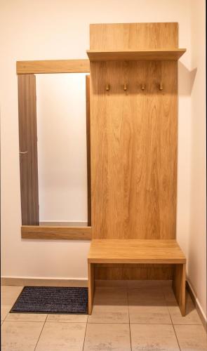 a dressing room with a mirror and a wooden cabinet at Beseda in České Budějovice