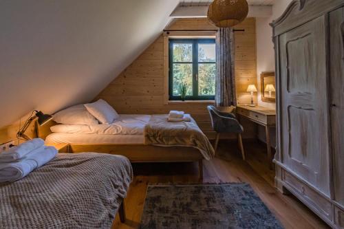 Postel nebo postele na pokoji v ubytování Willa Zielona Jabłonka