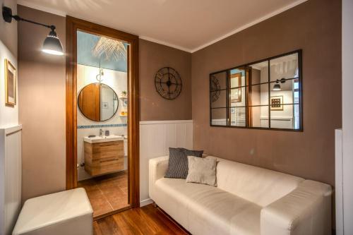 a living room with a couch and a sink at Spanish Steps Miracle Suite in Rome