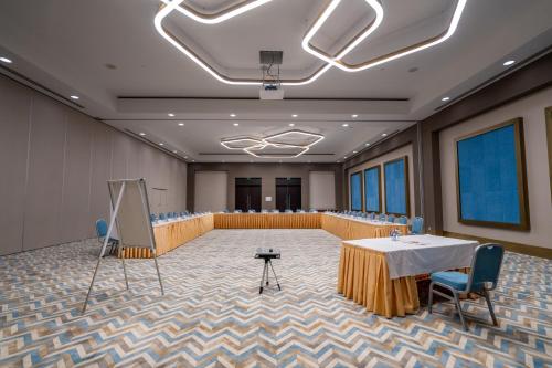a conference room with a table and chairs and a podium at Lara Barut Collection-Ultra All Inclusive in Lara