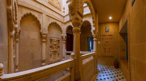 a hallway of a building with a door and a tile floor at Hotel Akashdeep - Located City Centre in Jaisalmer