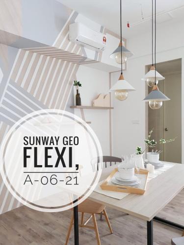 a dining room with a table and pendant lights at Geo Suite - Sunway Pyramid & Sunway Lagoon in Petaling Jaya