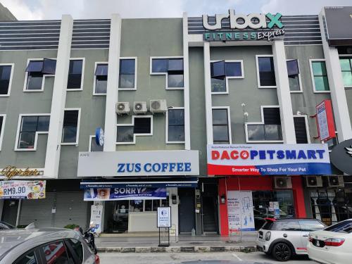 a building with cars parked in front of it at PoolView Waterpark 300Mbps Ipoh Homestay Manhattan Condo 4-7pax 3bedroom Station 18 pengkalan in Ipoh