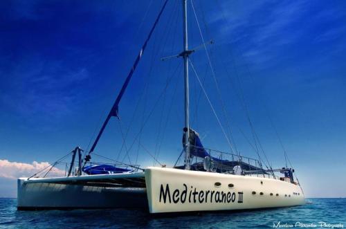 a boat sitting in the water on the ocean at Tsokkos Gardens Hotel in Protaras