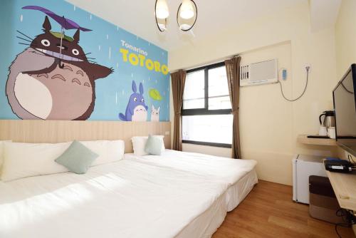 Una cama o camas en una habitación de Taichung FJ Victoria