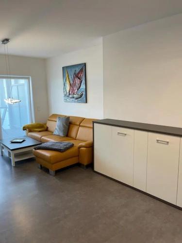 a living room with a couch and a table at Ferienhof Elbaue in Schönebeck