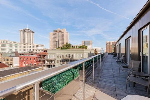 a balcony with a view of the city at The Bonaparte in New Orleans