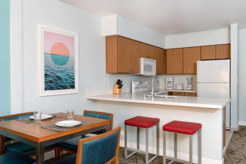 a kitchen and dining room with a table and chairs at WorldMark Anaheim in Anaheim