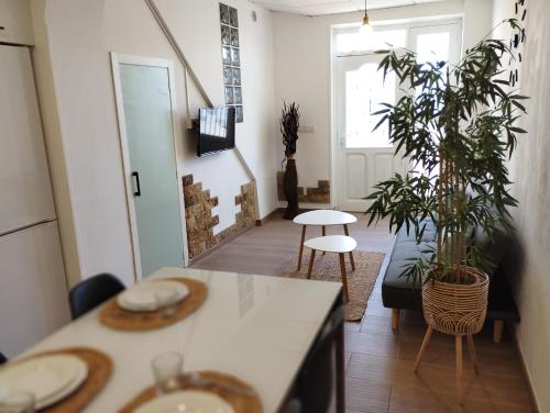 a kitchen with plants and a table in a room at BellAltea in Altea