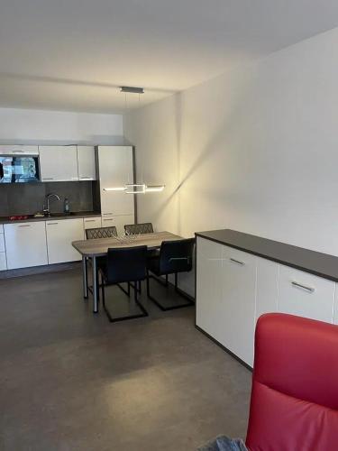 a kitchen with a table and chairs in a room at Ferienhof Elbaue in Schönebeck