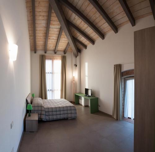Ένα ή περισσότερα κρεβάτια σε δωμάτιο στο Agriturismo Mascudiera