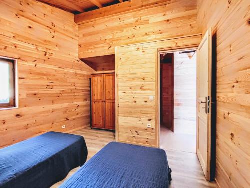 Katil atau katil-katil dalam bilik di Chalet Mounette Ski Sauna Lac Embrun